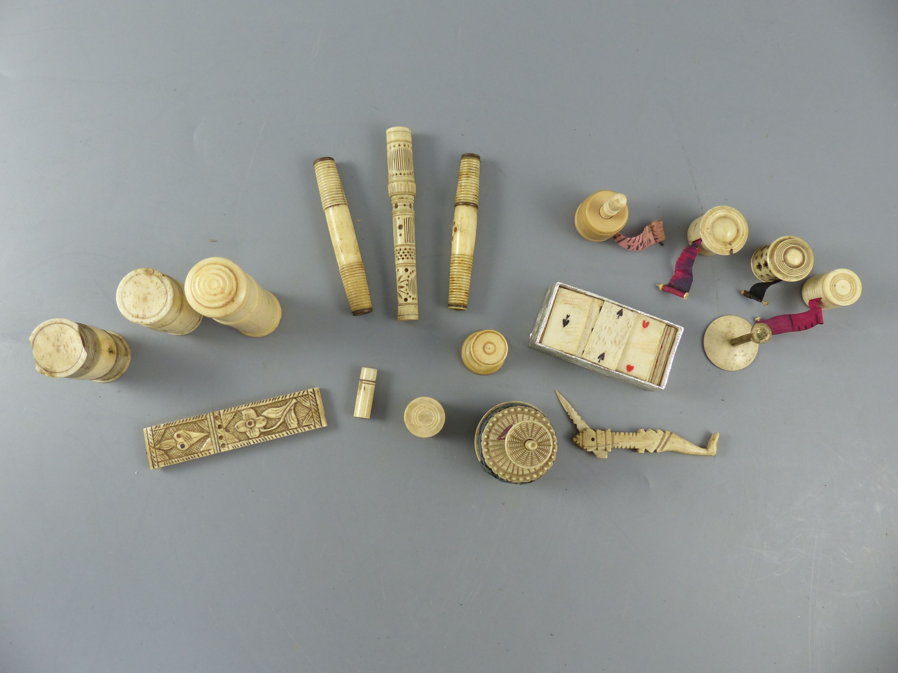 A collection of assorted 19th century bone sewing implements and objets dart